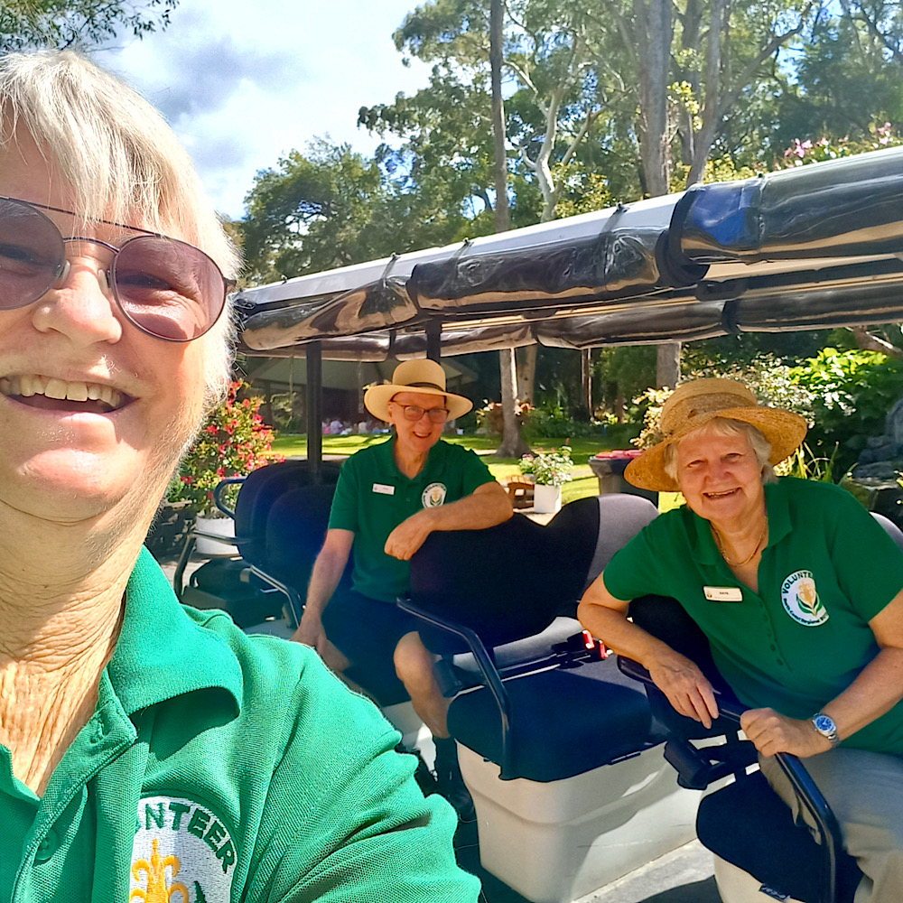 Smiling volunteers with eBuggy